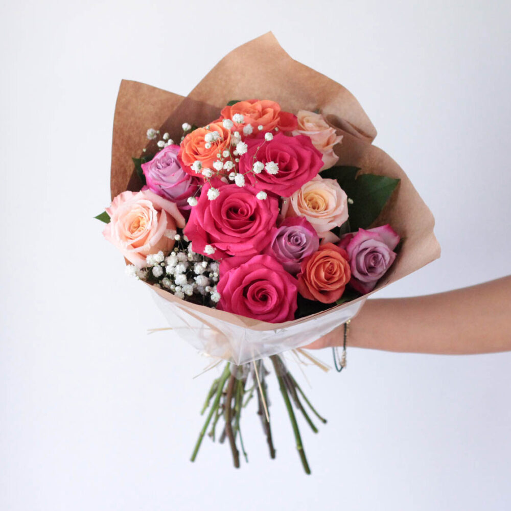 Wrapped Multicolored Dozen Roses with Babies' Breath and Greens